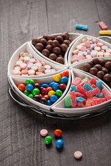 Large container with separated assortments of colorful candy
