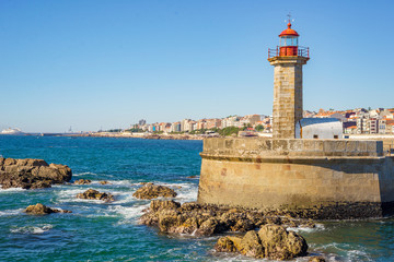 CIty lighthouse day sun seafront waterfront pierhead