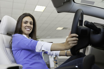 Low angle view of beautiful woman sitting in car