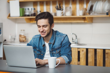 Young man with beard working on laptop