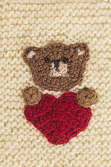 knitted bear with a heart