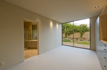 Empty room with view of porch through closed glass door