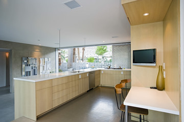 View of a spacious kitchen in house with outdoor view