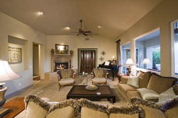 Spacious living room interior with piano in the background at home