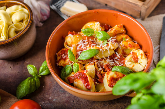 Homemade tortellini with tomato sauce