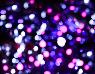 Glitter lights background. Holiday bokeh texture. Multicolored light. Defocused