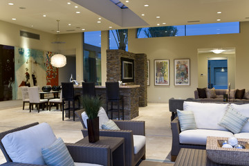 Spacious and modern living room with dining area in the background
