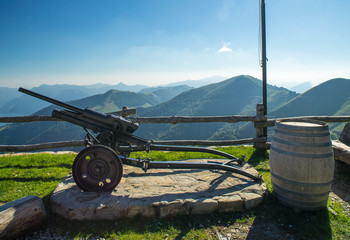 Fototapeta na wymiar Gun - a monument in the mountains of Italy.