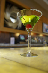 Closeup of a martini on bar counter