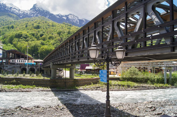 Fototapeta na wymiar Iron bridge over the river.