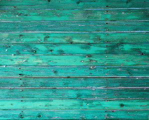 Painted bright turquoise wooden background; weathered wooden wall, horizontal, bright