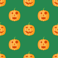 Seamless pattern with halloween pumpkins on green background. Vector texture.