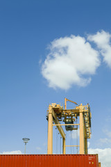Crane and cargo container against the sky at dock in Limassol Cyprus
