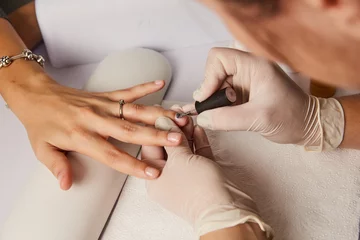 Fotobehang Women's manicure, Nail Polish, Hand Care © pavlovski