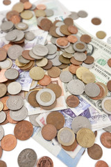 Close-up of paper currencies and coins