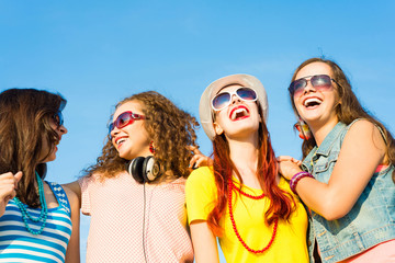 group of young people wearing sunglasses and hat