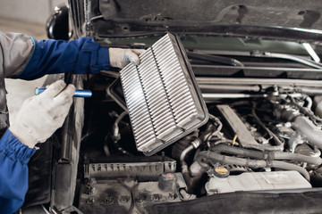 Car mechanic symptoms analysis part air filter of engine for maintaining  isolated on white background with clipping path