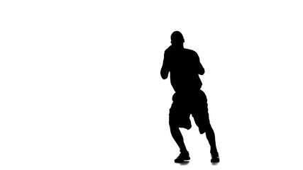 Basketball player jumps up and throws the ball up. White background