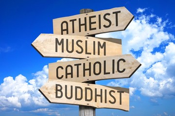 Wooden signpost with four arrows - Atheist, Muslim, Catholic, Buddhist - great for topics like religion, faith etc.