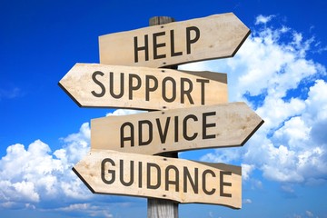 Wooden signpost with four arrows - help, support, advice, guidance - great for topics like...
