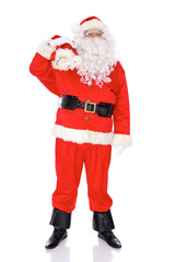 Santa Claus standing with his sack full of presents, isolated on white background. Full length portrait