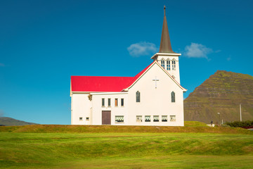 Fototapeta na wymiar Lonely Church illuminated by sun at Iceland, summer time