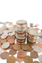Close-up of heap of coins over white background