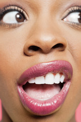 Naklejka premium Detail shot of a shocked young woman looking to her side