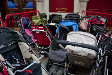 Group of prams outside theatre