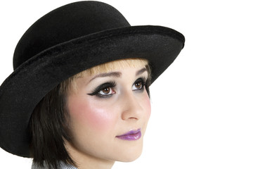 Close-up of young woman wearing hat over white background
