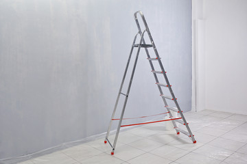 Ladder standing in empty room