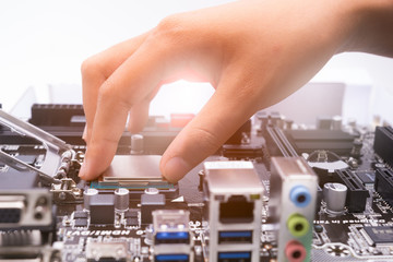 Assembling high performance personal computer, inserting CPU, pr