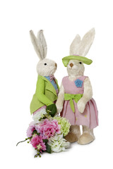 Obraz premium Female and male Rabbits with flower bouquet standing over white background