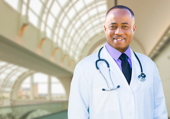 Handsome African American Male Doctor Inside Hospital Office.