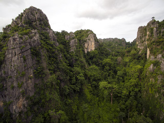 Aerial view of limestone mountain Karst, the Avatar-like mountain pass of sharp cliffs, peak forest and sinkhole landscape made up of carbonate rocks, Devonian limestone