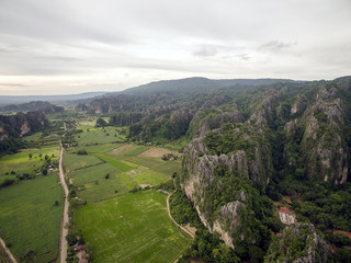 Aerial view of limestone mountain Karst, the Avatar-like mountain pass of sharp cliffs, peak forest and sinkhole landscape made up of carbonate rocks, Devonian limestone