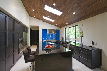 Interior of modern kitchen with breakfast bar