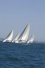 View of four yachts competing in team sailing event