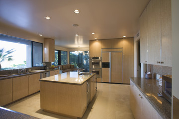 View of a spacious kitchen with island in house