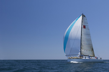View of a yacht competing in team sailing event