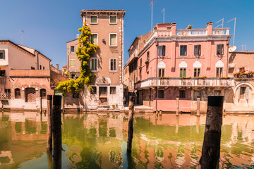 Chioggia houses create colorful reflections in the water of the