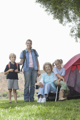 Fototapeta premium Portrait of kids with mother and grandmother on camping trip