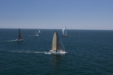 Fototapeta premium View of five yachts competing in team sailing event