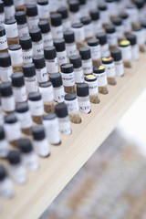 Closeup of vials in wooden stand at laboratory