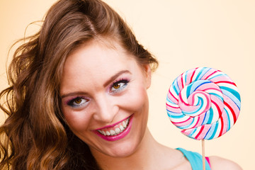 Woman joyful girl with lollipop candy