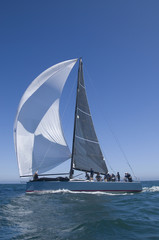 Obraz premium View of a yacht competing in team sailing event