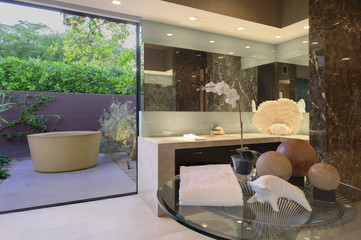 Artwork of freestanding bath in California bathroom