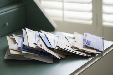 Closeup of letters on writing desk at home