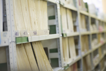 Color coded filing system on library shelves