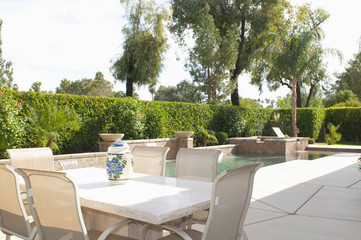 Cream dining furniture at poolside